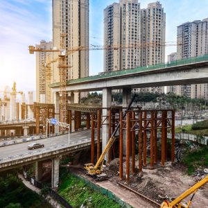 Construction of tall concrete pylon of bridge using tower crane